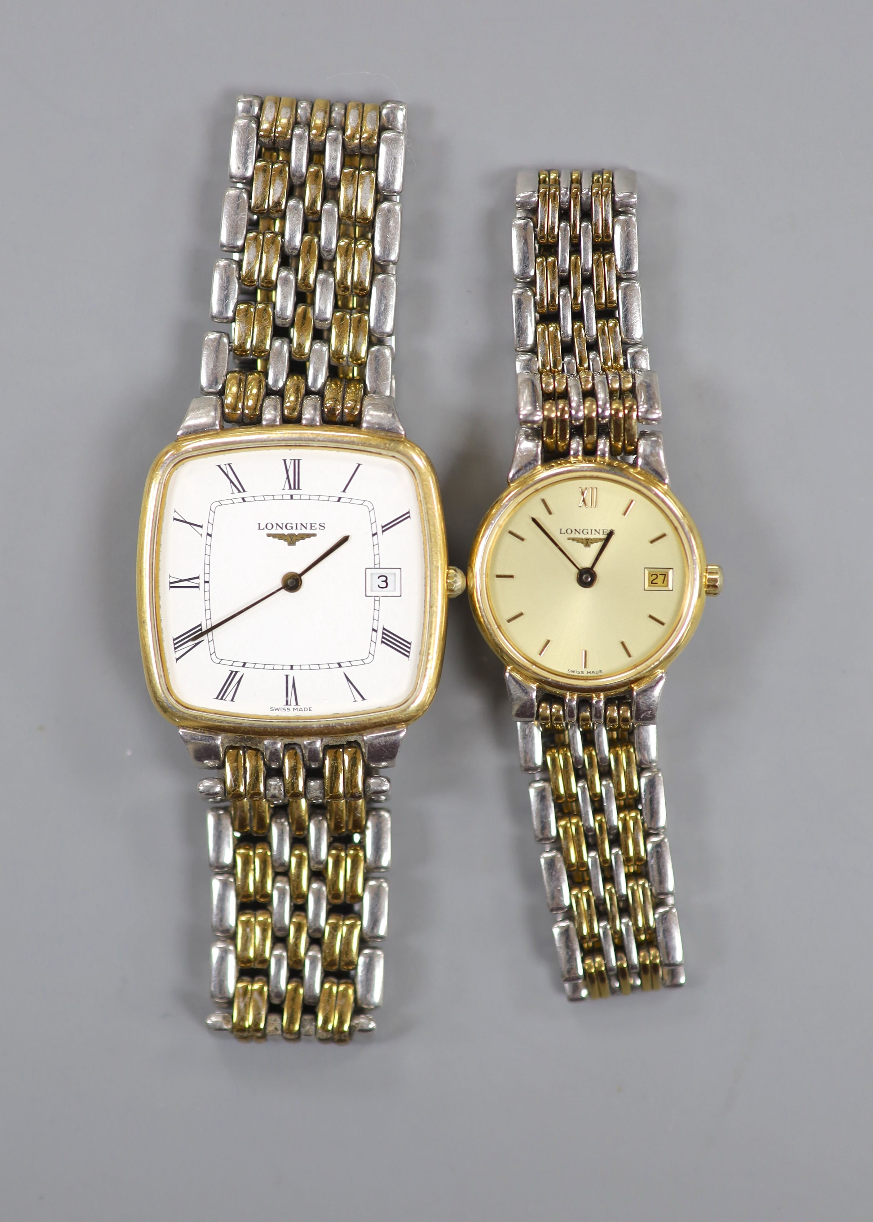 A gentleman's steel and gold plated Longines quartz wrist watch and a similar lady's watch.